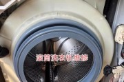 以直筒洗衣机的拆开清洗方法（轻松解决洗衣机内部污垢问题）